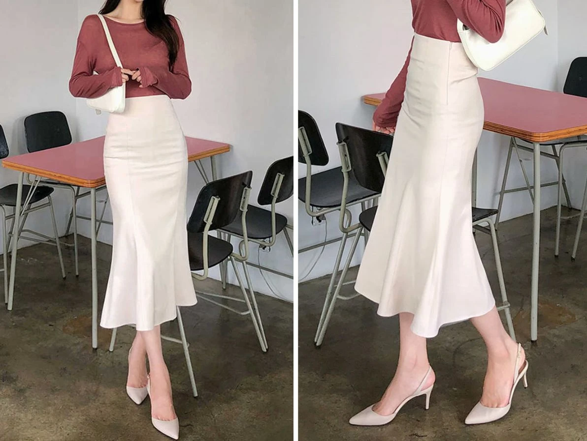 Phối đồ với chân váy đuôi cá dài và áo blouse trắng thanh lịch.